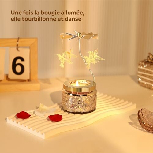 Bougie avec carrousel de colibris décoratif.